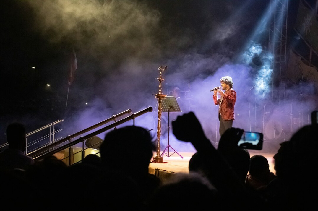 Speaker addressing an audience on stage