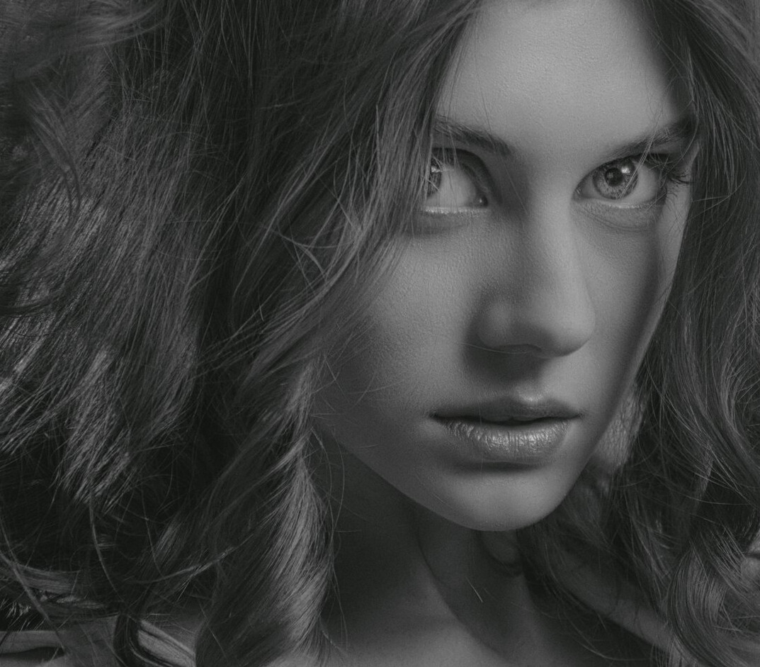 Portrait of a young woman with long hair