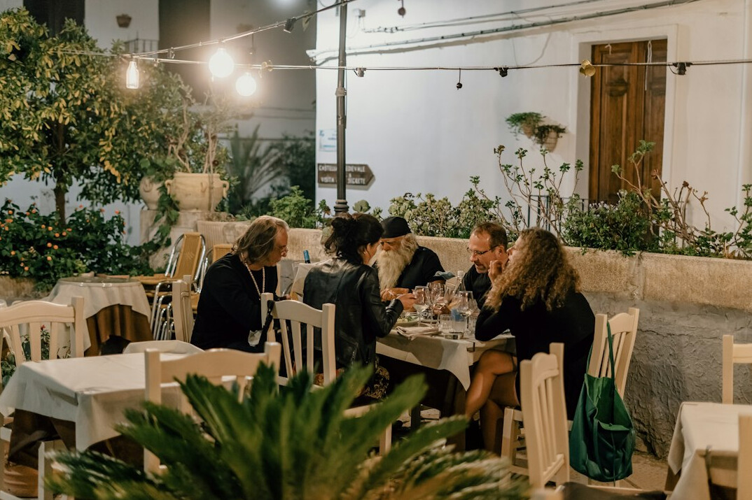 Diverse group of colleagues discussing ideas around a table